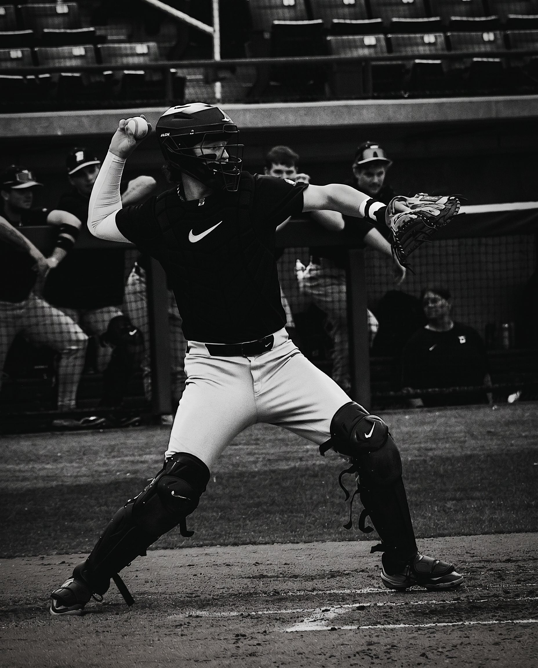 Catcher framing a pitch under stadium lights